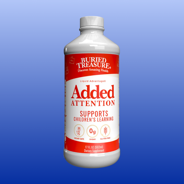 Bottle of Buried Treasure Added Attention supplement on a blue background