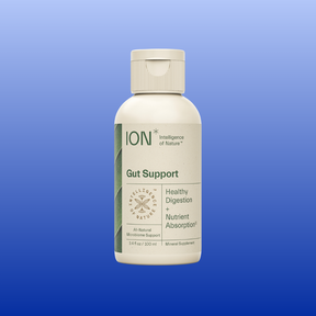 Bottle of ION Gut Support liquid supplement for healthy digestion and nutrient absorption on a blue background