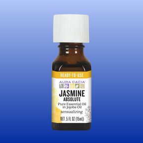Bottle of Jasmine Absolute Precious Essential Oil 0.5 oz in jojoba oil with a white cap and yellow label on blue background