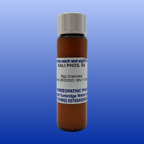 Brown vial of Kali Phos 6X lactose-free homeopathic cell salt granules with white label and gray cap