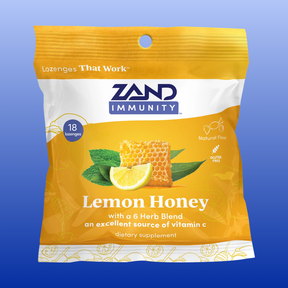 Zand Immunity Lemon Honey lozenge package on a blue background