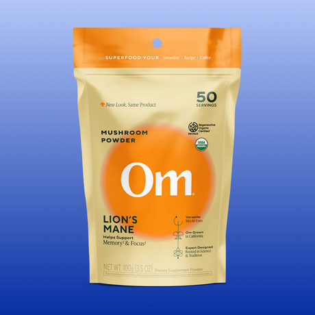 Package of Om Lion's Mane mushroom powder on a blue background