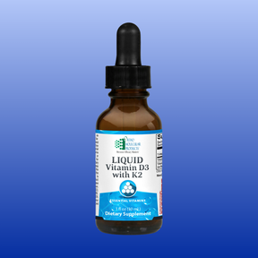 Ortho Molecular Liquid Vitamin D3 with K2 dietary supplement in a 1 oz brown dropper bottle against blue background