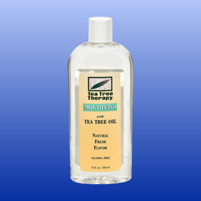 Clear 12 oz bottle of Tea Tree Therapy mouthwash with natural fresh flavor and alcohol free formula