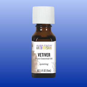 Bottle of Aura Cacia Vetiver pure essential oil 0.5 fl oz with white cap on blue gradient background