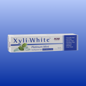 XyliWhite Platinum Mint toothpaste gel with baking soda, fluoride-free, whitening, fresh taste, 6.4 oz tube on blue background