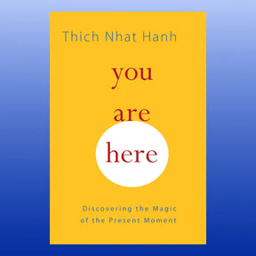 Book cover of "You Are Here" by Thich Nhat Hanh with yellow background and red and blue text about mindfulness.